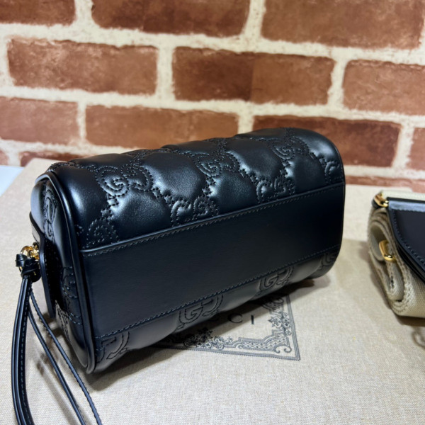 G*u*i gg matelassé leather top handle bag