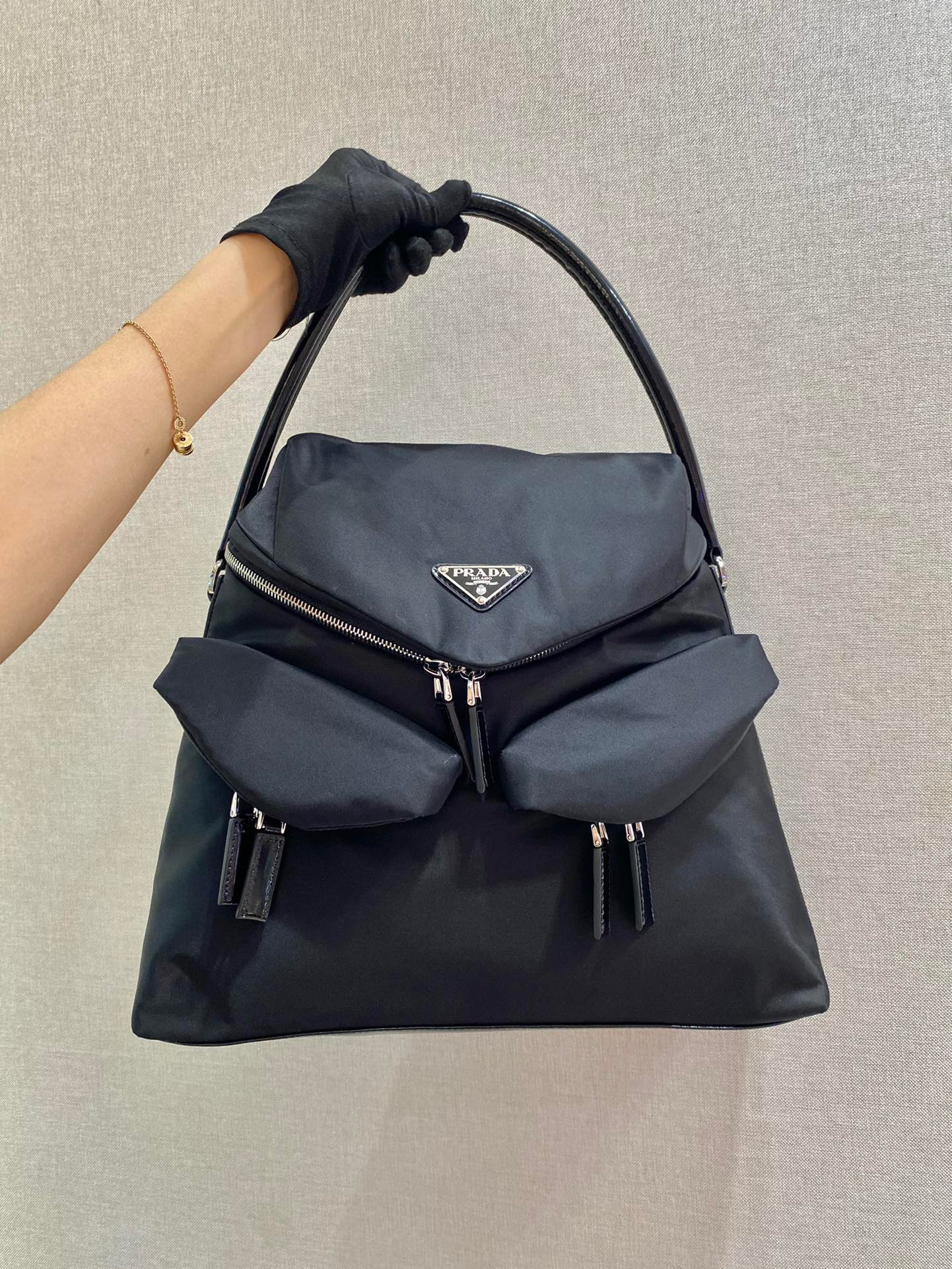 Pra*a signaux nylon and leather hobo bag